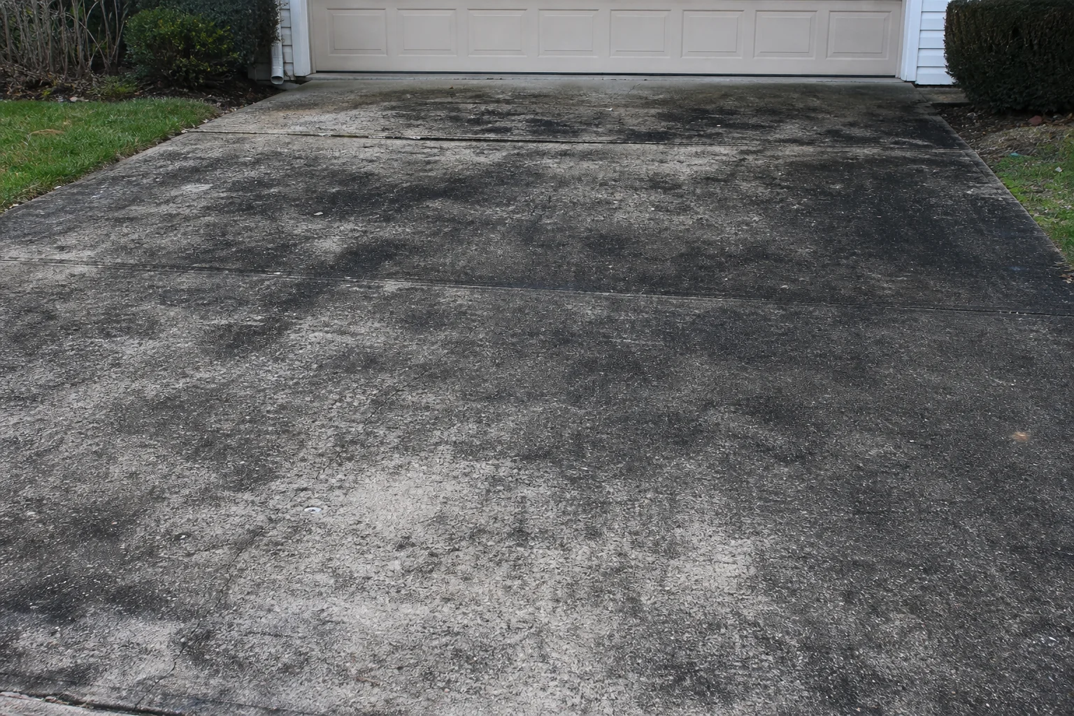 Driveway before pressure washing